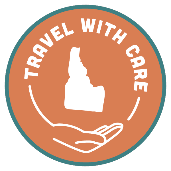 A giphy showing a circular, rotating Travel With Care icon.