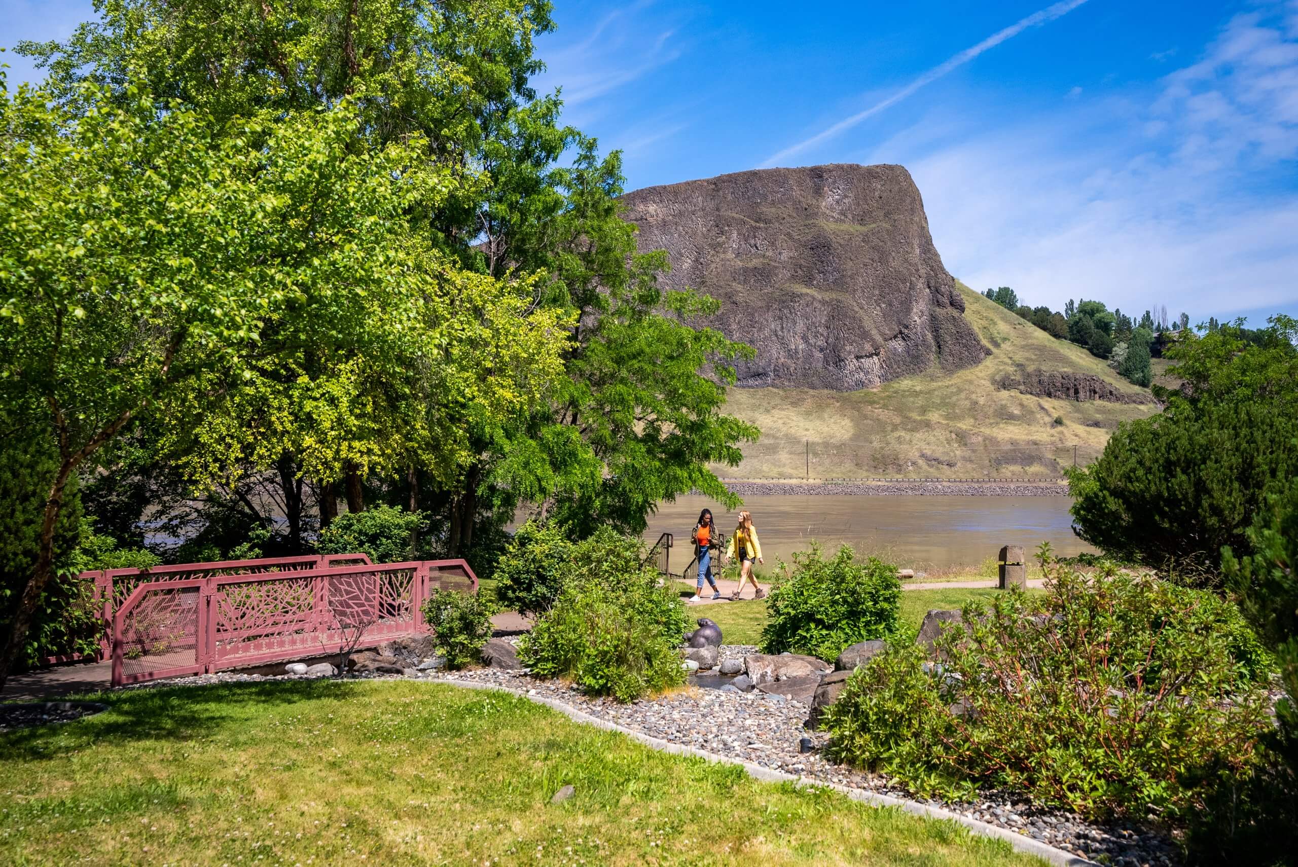 Two women walk along a pathway at the Lewis and Clark Discovery Center.