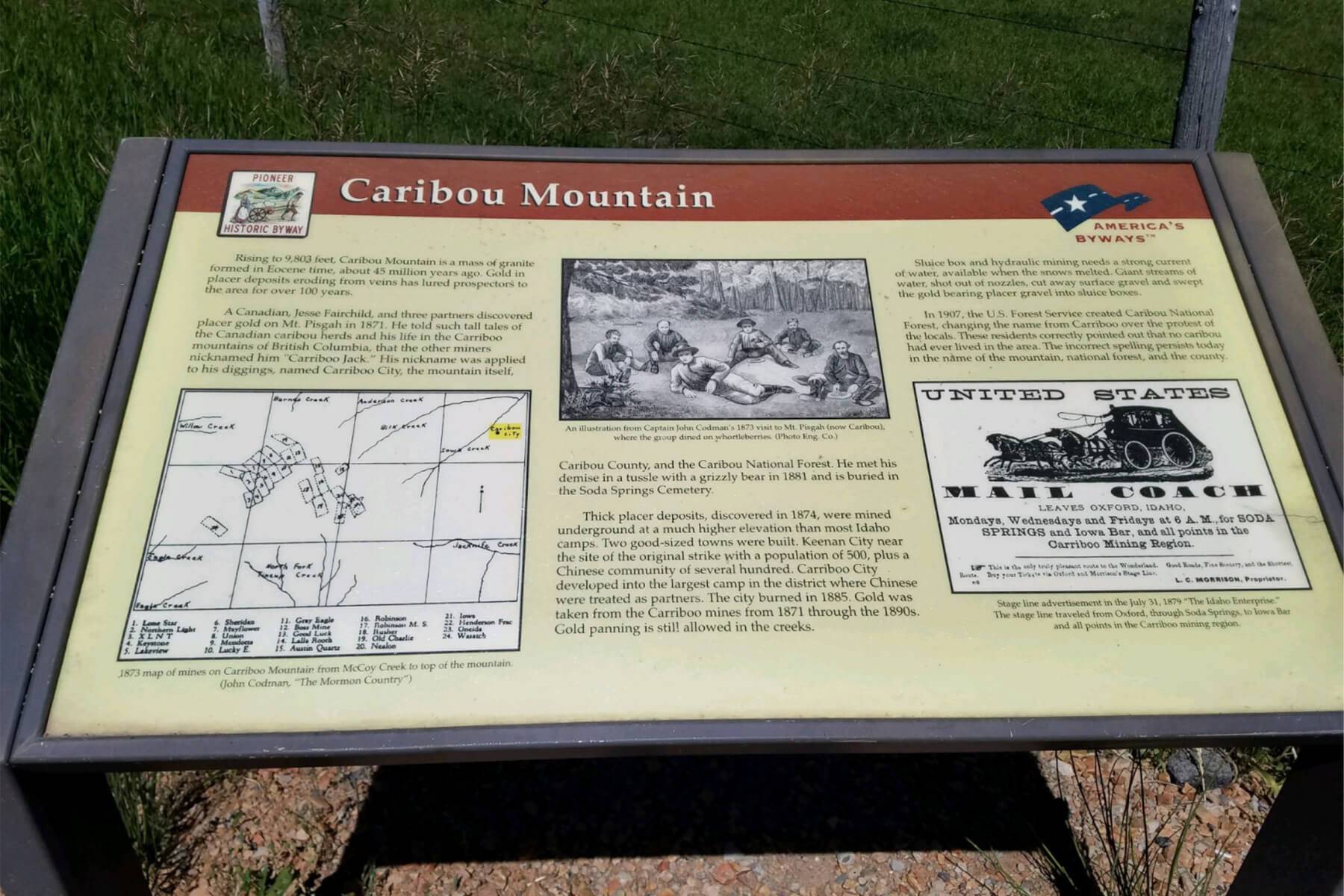a sign depicting information about Caribou Mountain, including a map and historical illustrations