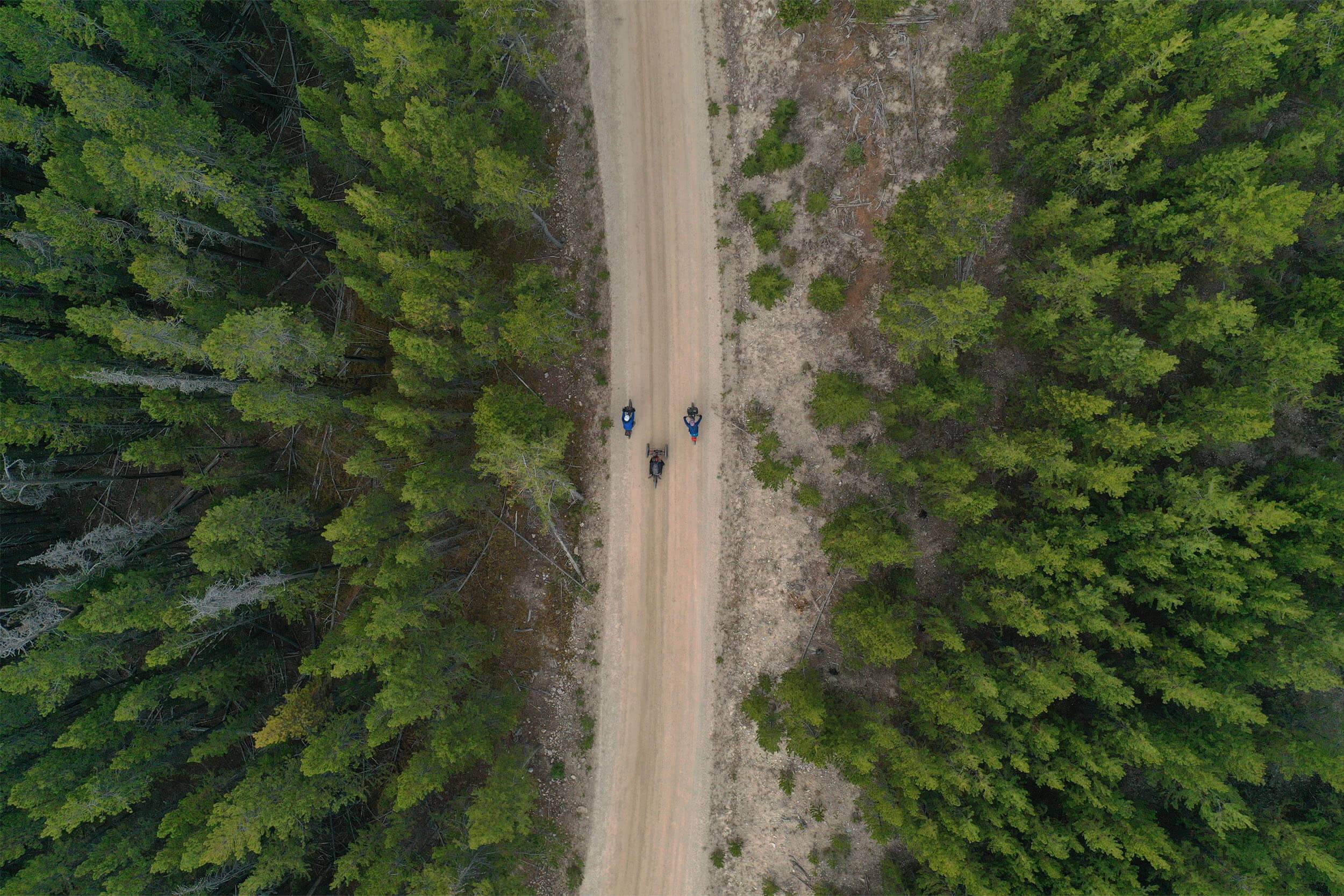 An aerial shot of bikers headed north on Forest Road 185