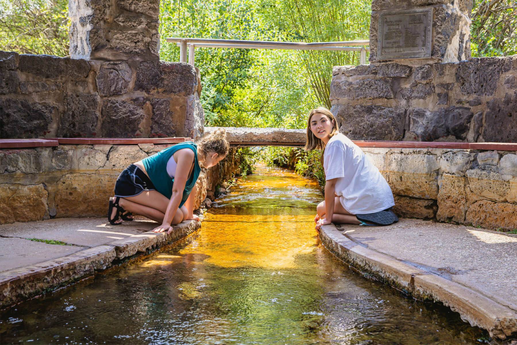 two girls look at the water in Hooper Springs Park