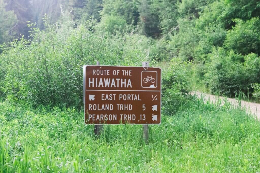 brown wayfinding signage pointing to the route of the Hiawatha area