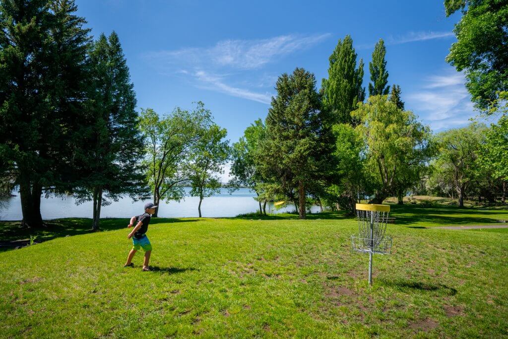 A child playing disc golf at Lake Walcott State Park.