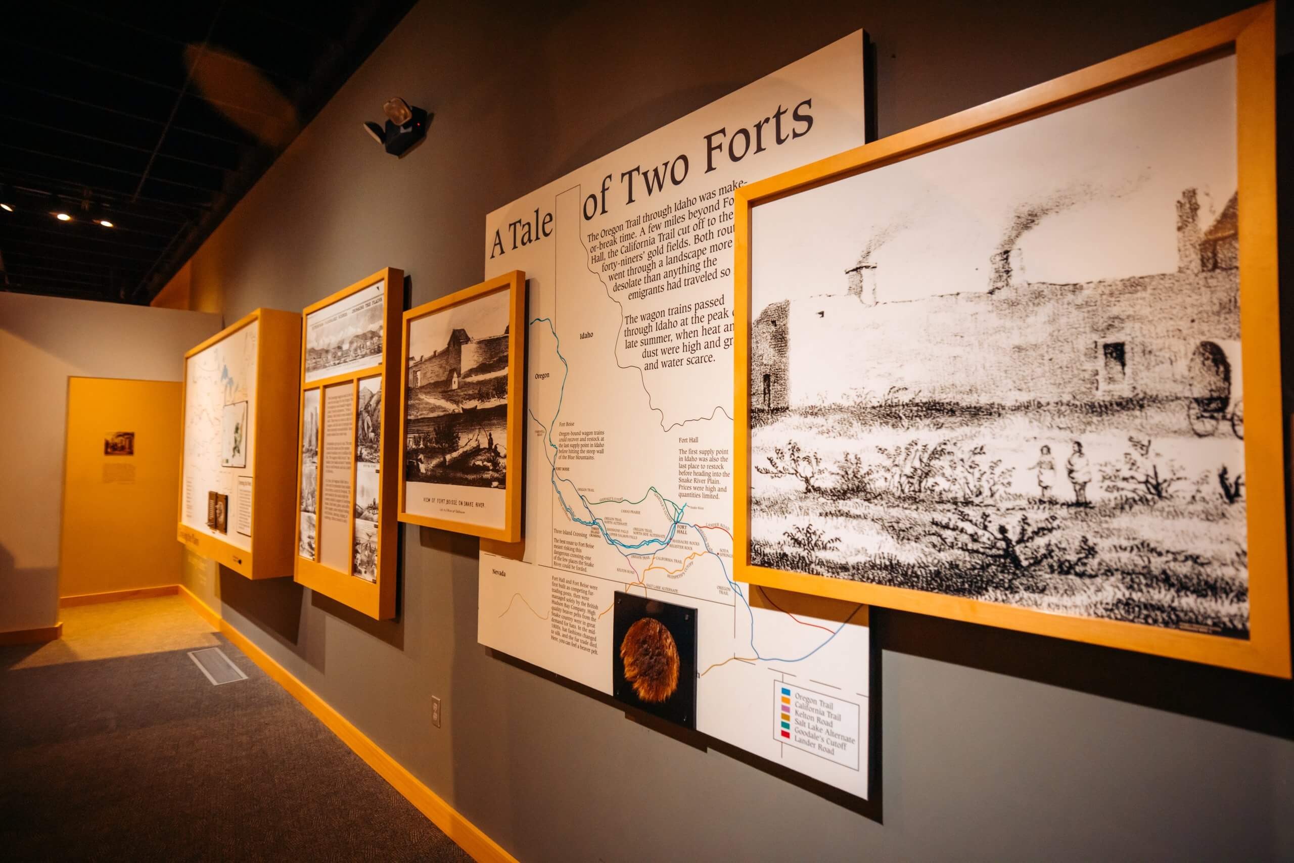 Informational signs and historical photos inside the Oregon Trail History and Education Center.
