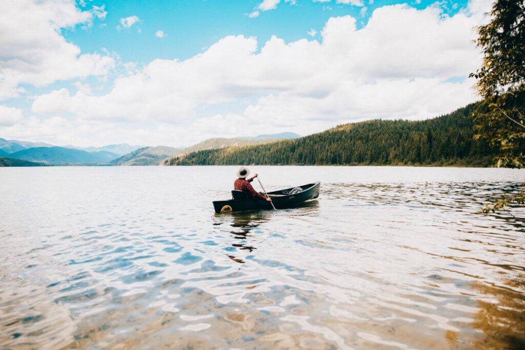 Person in a canoe on Priest Lake.