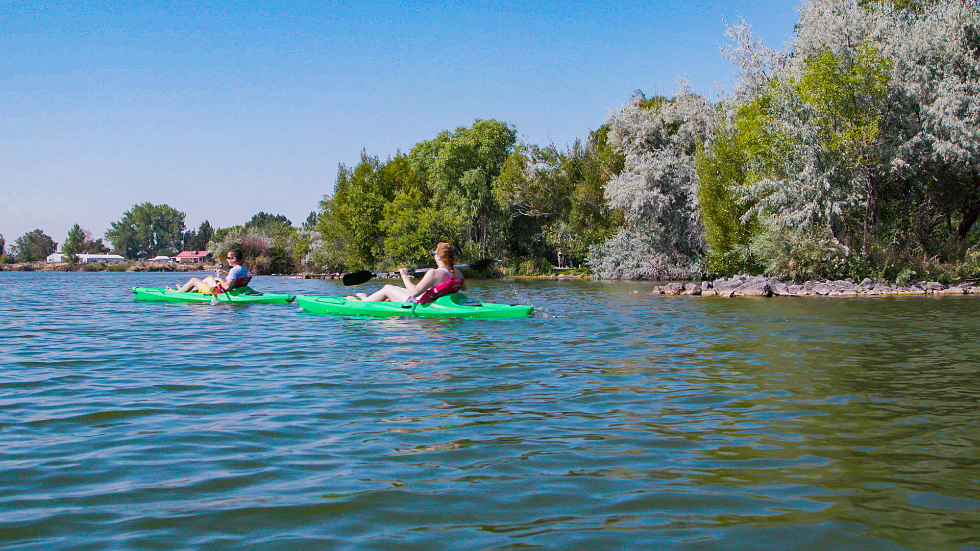 Two people kayak at Lake Walcott State Park.